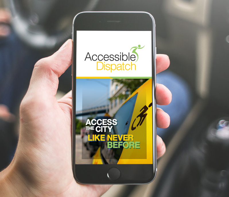 Hand holding a cell phone open to the Accessible Dispatch mobile app. The screen shows the Accessible Dispatch logo with 'Access the City like never before' on the backdrop of a yellow taxi.