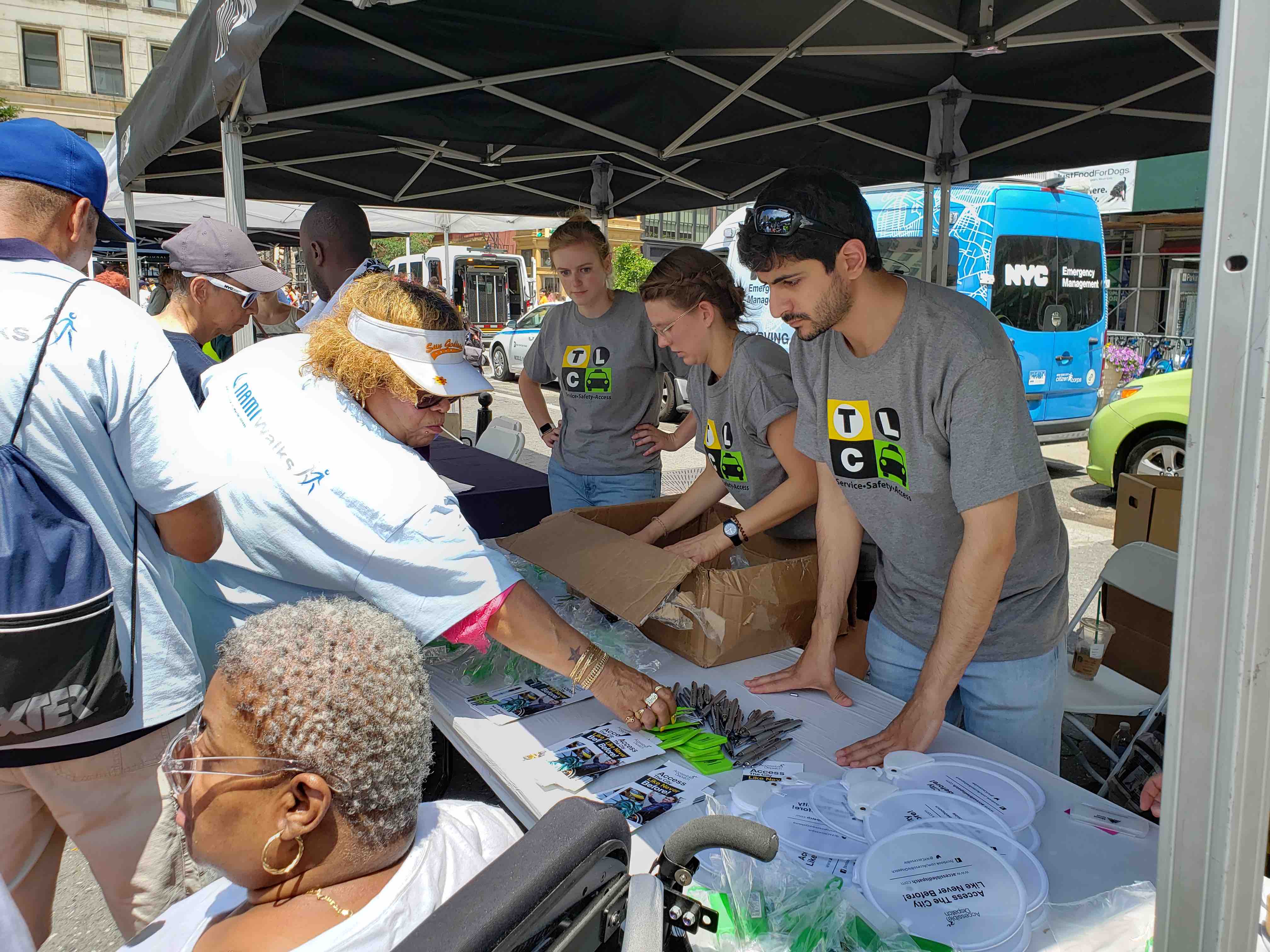 TLC team informing people about Accessible Dispatch Program during fifth annual disability pride parade